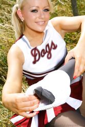 Gorgeous cheerleader Tess reveals her saggy tits and poses half naked outside
