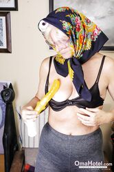 Granny with eyeglasses Christina toying her mature vagina on the carpet