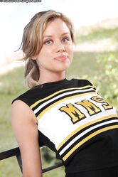 Sexy cheerleader Summer strips on the balcony and flaunts her fantastic body