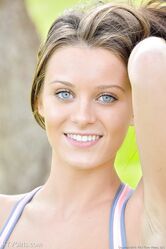 Petite blue-eyed brunette Lana strikes sexy nude poses outdoors