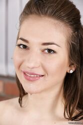 Skinny brunette Roxy pisses herself, strips and pumps her bald pussy