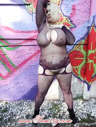 Voluptuous blonde MILF Samantha 38G showing her huge natural tits in fishnets