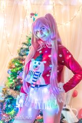 Cosplay babe Jeny Smith shows her pussy in an upskirt by the Christmas tree