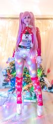 Cosplay babe Jeny Smith shows her pussy in an upskirt by the Christmas tree