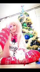 Cosplay babe Jeny Smith shows her pussy in an upskirt by the Christmas tree