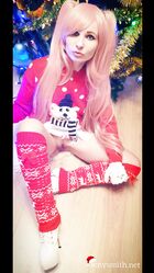Cosplay babe Jeny Smith shows her pussy in an upskirt by the Christmas tree