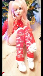 Cosplay babe Jeny Smith shows her pussy in an upskirt by the Christmas tree