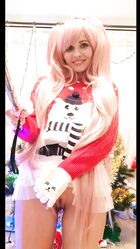 Cosplay babe Jeny Smith shows her pussy in an upskirt by the Christmas tree