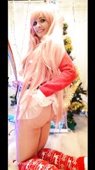 Cosplay babe Jeny Smith shows her pussy in an upskirt by the Christmas tree