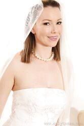 Hot bride with big tits Nicky Phillips takes off her wedding dress and poses