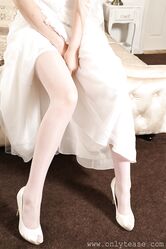 Hot bride with big tits Nicky Phillips takes off her wedding dress and poses