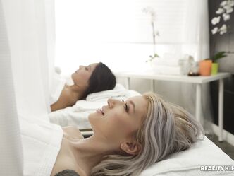 Slim friends Jynx Maze and Arya Fae share a masseur's dong after a massage