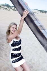Sweet teen with blue eyes Luciana A unveils her natural tits on the beach