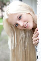 Blonde teen with small tits Alysha flaunts her tasty love hole on a terrace