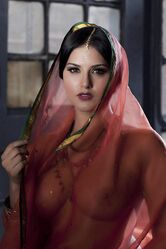Busty solo girl Sunny Leone models solo in see thru Indian attire