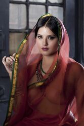 Busty solo girl Sunny Leone models solo in see thru Indian attire