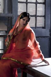 Busty solo girl Sunny Leone models solo in see thru Indian attire