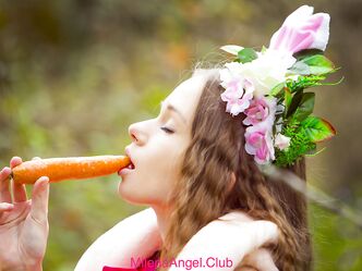 Cute brunette babe Milena Angel stuffs her twat with a carrot outdoors