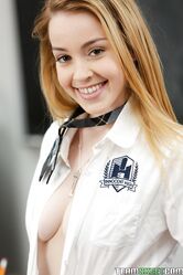 Cute chick in school uniform Alexia Gold teasing on the classroom desk