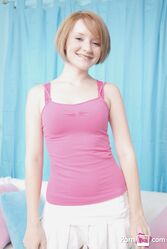 Petite cutie with small boobs Faith Daniels shows off her body while stripping