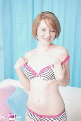 Petite cutie with small boobs Faith Daniels shows off her body while stripping