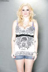 Pregnant blonde pornstar Haley Cummings exposes her huge dark nipples & belly