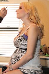 Pregnant blonde pornstar Haley Cummings exposes her huge dark nipples & belly