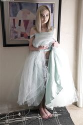 Pretty teen Lexi Lore hikes her dress & spreads to flash her sheer panties