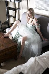 Pretty teen Lexi Lore hikes her dress & spreads to flash her sheer panties