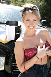 Bubble butt cowgirl Harley Jade strips down naked while washing a black SUV