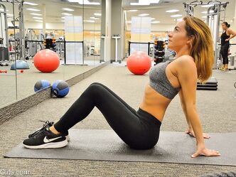 Hot babe Charlotte reveals her big juggs and petite figure while exercising