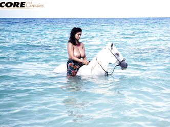 Solo model Chloe Vevrier unleashes her hooters during a day at the beach