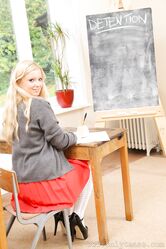 Sweet babe in a school uniform Hollie flaunts her big tits in the classroom