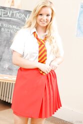 Sweet babe in a school uniform Hollie flaunts her big tits in the classroom