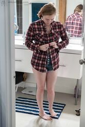 Sweet teen with small boobs Annika gets spied on while dressing in the toilet