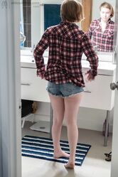 Sweet teen with small boobs Annika gets spied on while dressing in the toilet