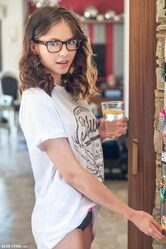 Teen with glasses Hilary gets nude in the kitchen to enjoy her lemon water