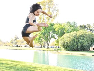 Teenage hottie in sexy outfit Zoe doing exercise outdoors by the water