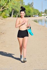 Amateur babe Carrie strips off her sportswear in public and poses naked