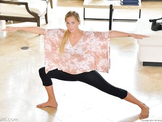 Busty beauty Courtney reveals her amazing curves while stretching on the floor