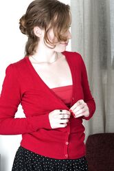 Natural redhead Ana Molly grabs her bare ass after exposing her naked bush