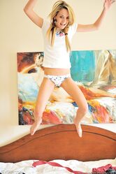 Skinny blonde Sara exposes her small ass and sticks a toy in her clam