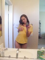 Amateur teen babe Casey posing topless in her black g-string panties
