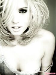 Gorgeous blonde Lexi Belle uncups her perky tits during solo action