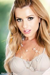 Sexy redhead Lexi Belle removes sensual lingerie to get naked on a veranda