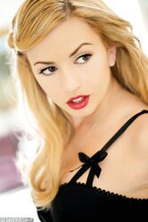 Slender blonde doll Lexi Belle poses in sexy outfit and shows beautiful cunt