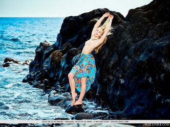 Blue eyed goddess Alice Blue enjoys the seaside wind kissing her smooth