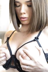Young beauty Eve Sweet masturbates with a vibrator in garters and nylons