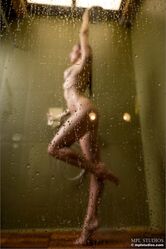 Slender beauty displays her great body while taking a shower
