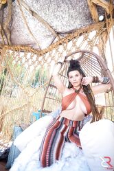 Young and busty brunette Indica Flower gets bare naked at a rural location